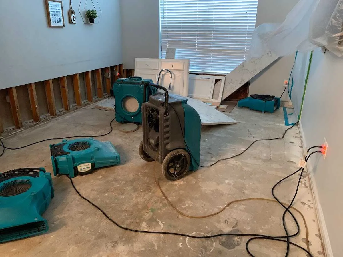 Dehumidifier in flood-cut room for Water Damage Restoration in Camp Swift
